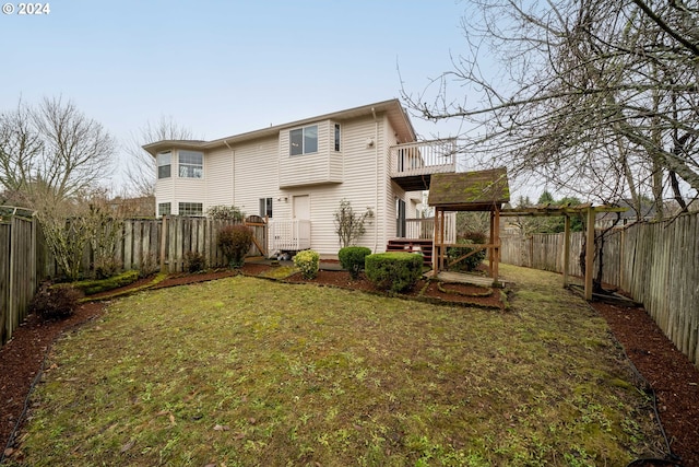 rear view of house with a lawn