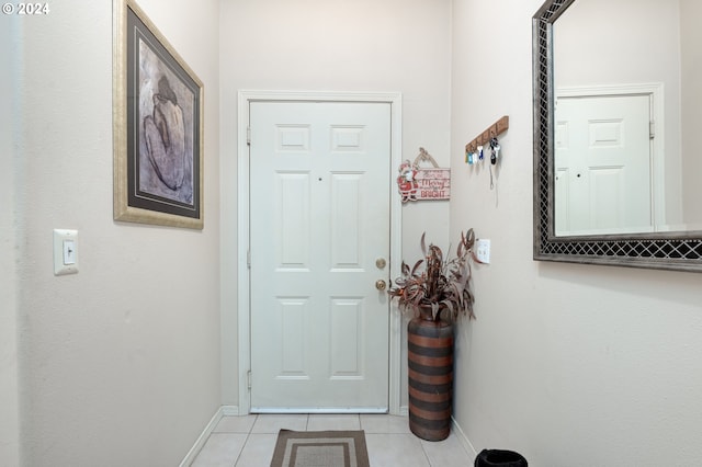 entryway with light tile patterned flooring