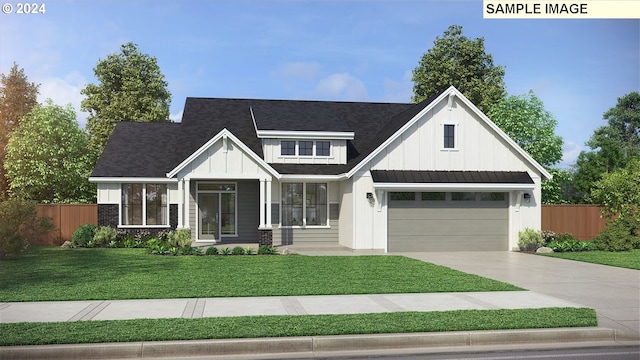 view of front of home featuring a garage and a front yard