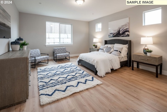 bedroom with hardwood / wood-style flooring