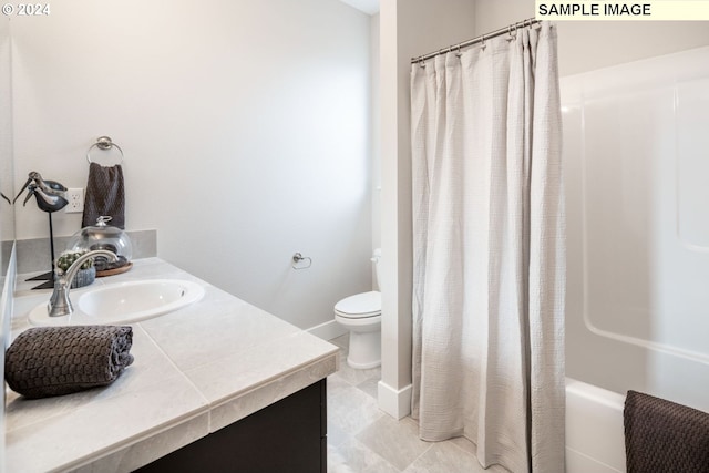 full bathroom featuring shower / tub combo with curtain, vanity, toilet, and tile flooring