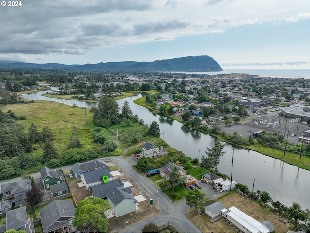 drone / aerial view with a water and mountain view