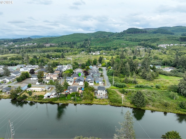 bird's eye view with a water and mountain view