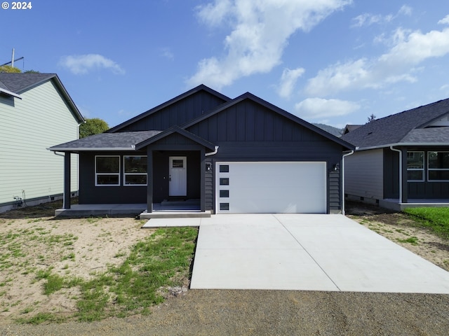 view of front of house with a garage and a porch