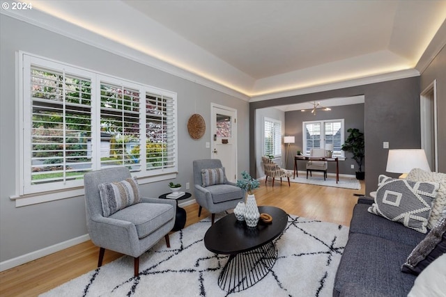 living room with a chandelier and wood-type flooring