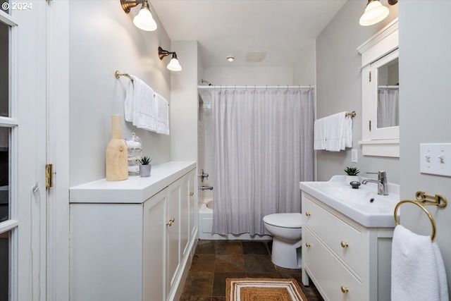 full bathroom featuring shower / bath combo, vanity, and toilet