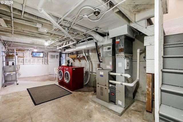 basement featuring separate washer and dryer and heating unit