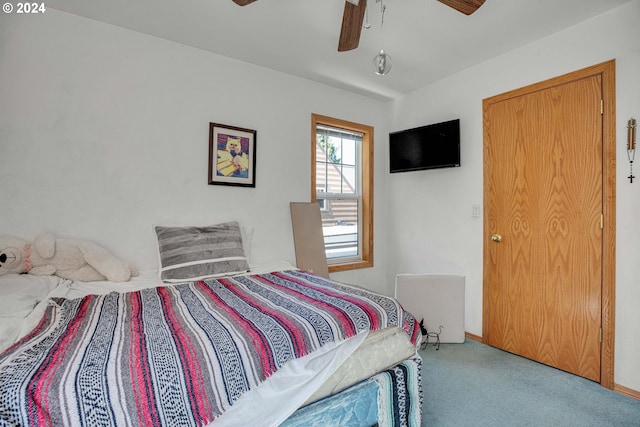 carpeted bedroom with ceiling fan