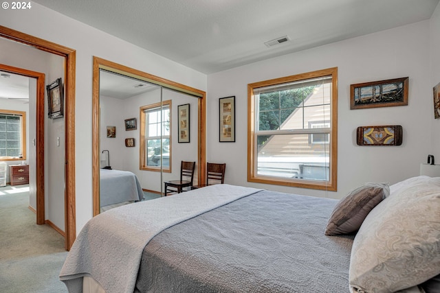 bedroom featuring a closet and carpet flooring