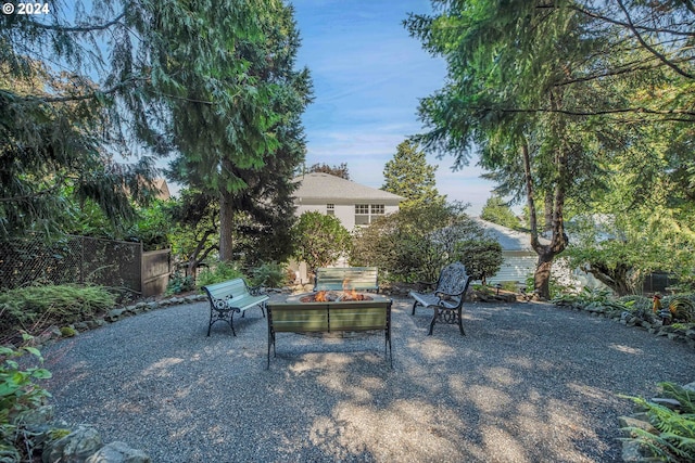 view of patio / terrace with a fire pit