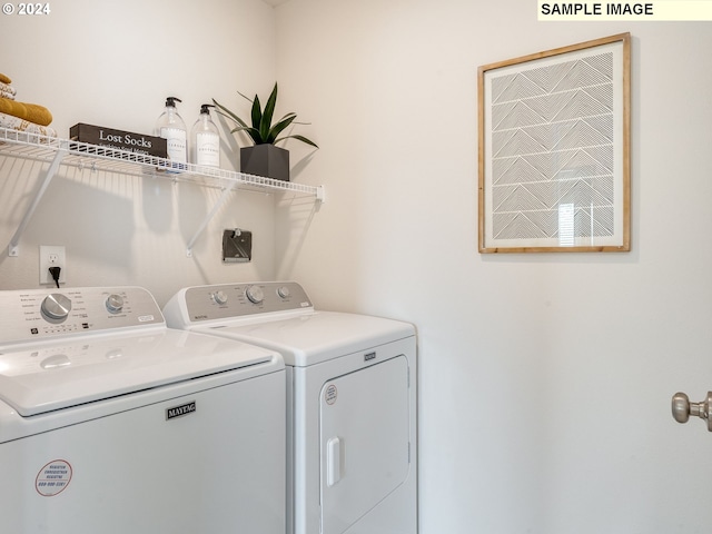 laundry area with separate washer and dryer