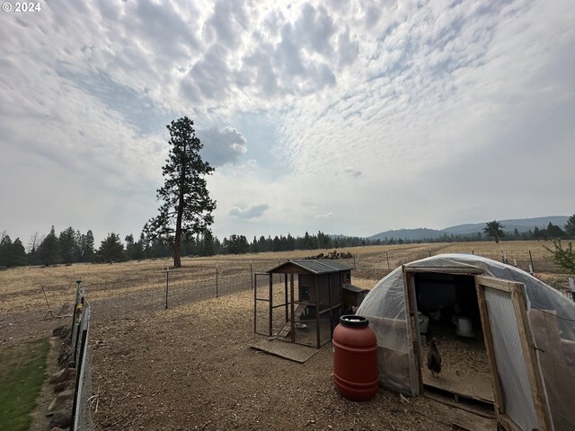 view of yard with a rural view