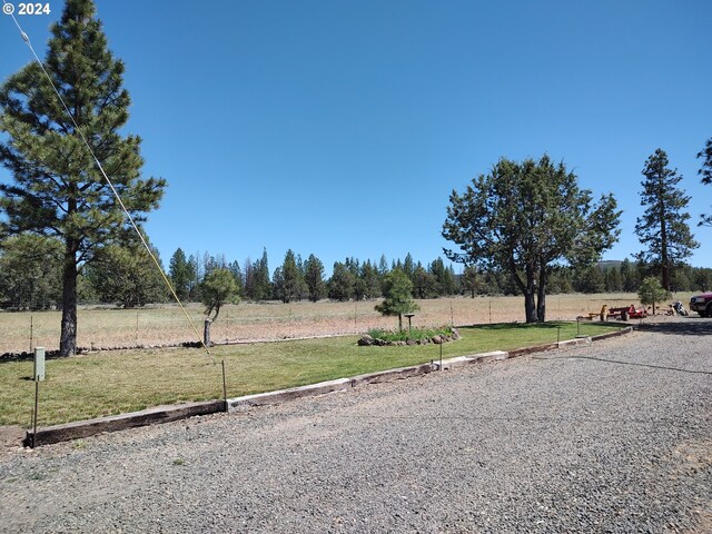 view of yard with a rural view