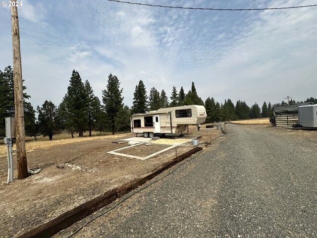 view of yard with a rural view