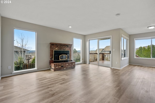 unfurnished living room featuring light wood-type flooring