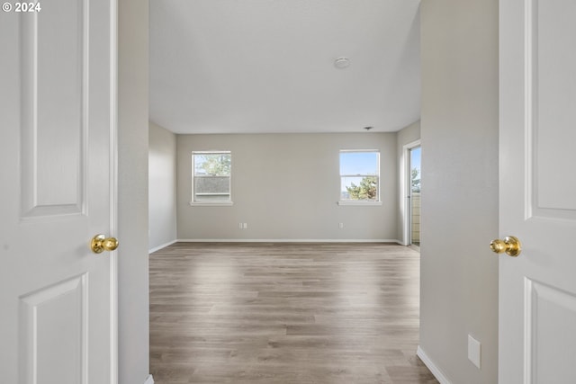 unfurnished room featuring light hardwood / wood-style floors