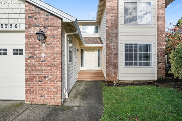 doorway to property featuring a garage