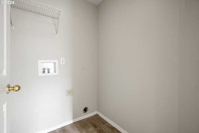 laundry room featuring hardwood / wood-style floors, electric dryer hookup, and hookup for a washing machine