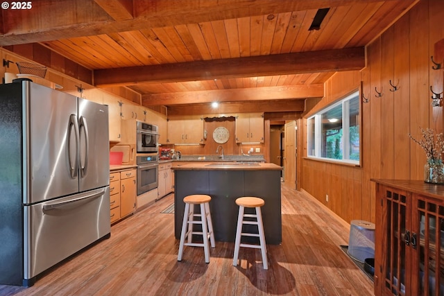 kitchen featuring stainless steel fridge, wooden ceiling, wooden walls, and beam ceiling