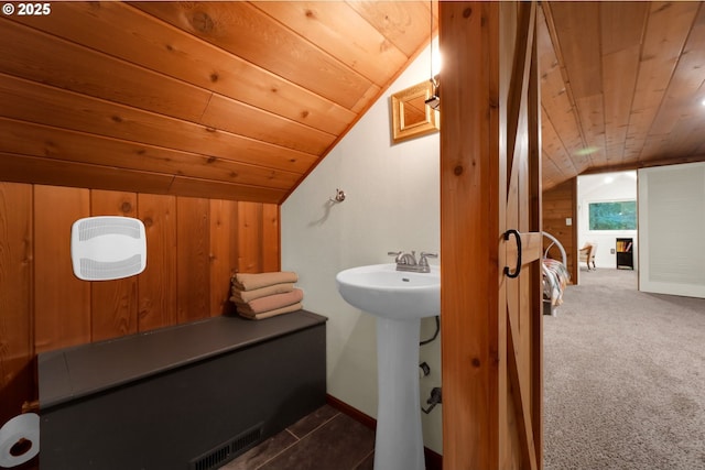 bathroom featuring sink, wooden ceiling, and lofted ceiling