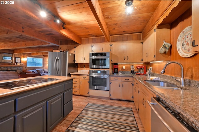 kitchen with track lighting, sink, beam ceiling, wood ceiling, and stainless steel appliances