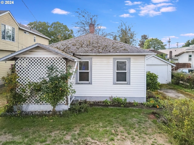 view of side of home featuring a lawn