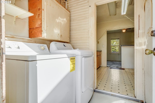 clothes washing area featuring separate washer and dryer