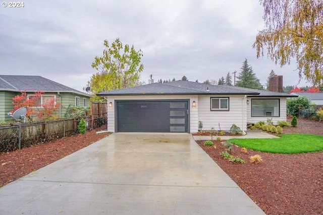 single story home featuring a garage