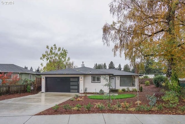 single story home with a garage