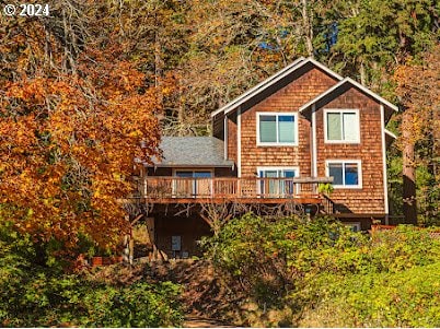 back of house featuring a deck