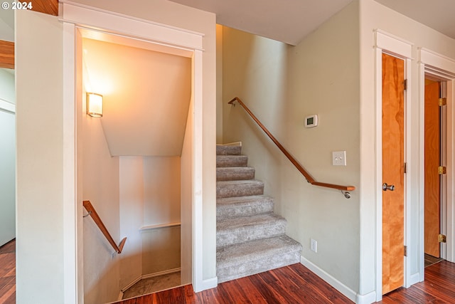 staircase featuring hardwood / wood-style floors