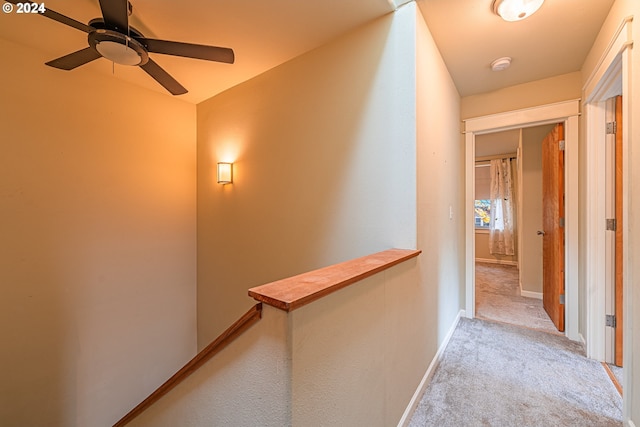 hallway with light colored carpet