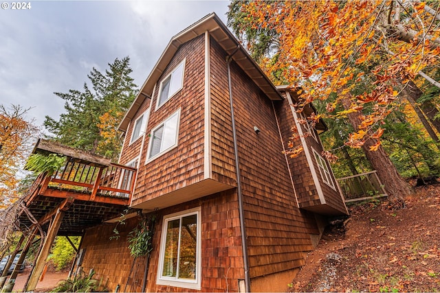 view of side of home with a deck