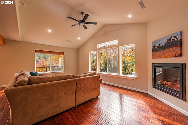 living room featuring hardwood / wood-style floors, ceiling fan, and lofted ceiling