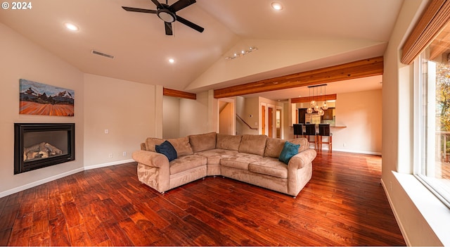 unfurnished living room featuring lofted ceiling, dark hardwood / wood-style floors, and ceiling fan with notable chandelier