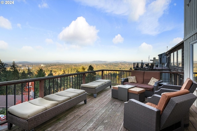 wooden deck with outdoor lounge area