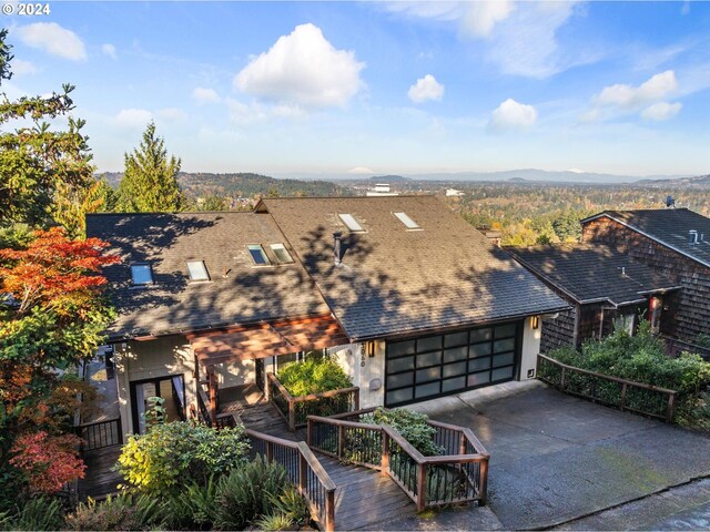 back of property featuring a wooden deck