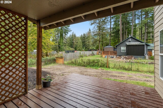 view of yard with a shed and a wooden deck