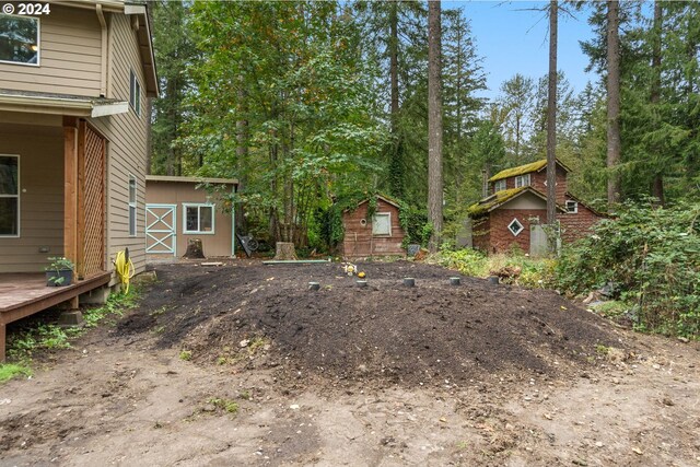 view of yard with a wooden deck