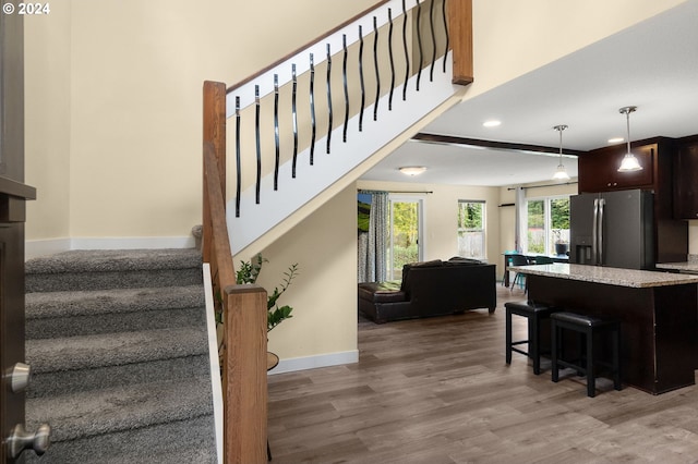 staircase with wood-type flooring