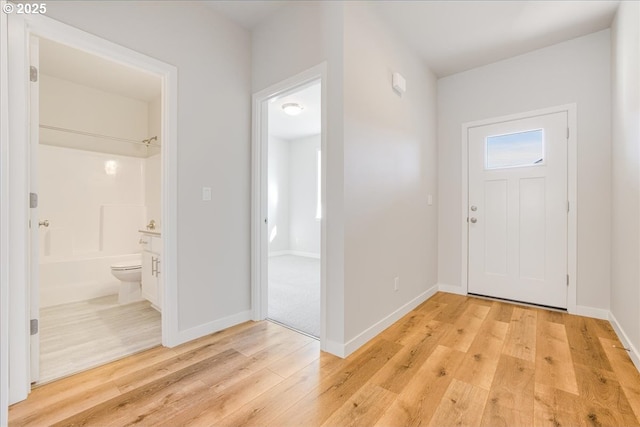 foyer with light hardwood / wood-style floors