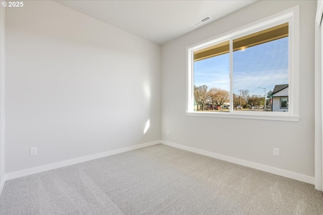 unfurnished room with carpet flooring