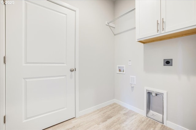 washroom featuring cabinets, electric dryer hookup, washer hookup, and light hardwood / wood-style floors