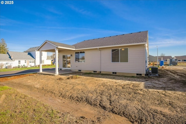 back of house with central AC unit and a patio