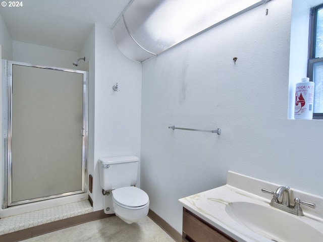 bathroom featuring an enclosed shower, vanity, tile patterned floors, and toilet