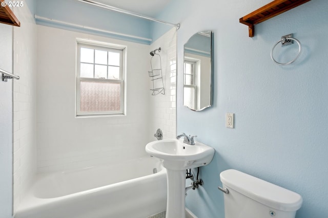 full bathroom with sink, toilet, and tiled shower / bath