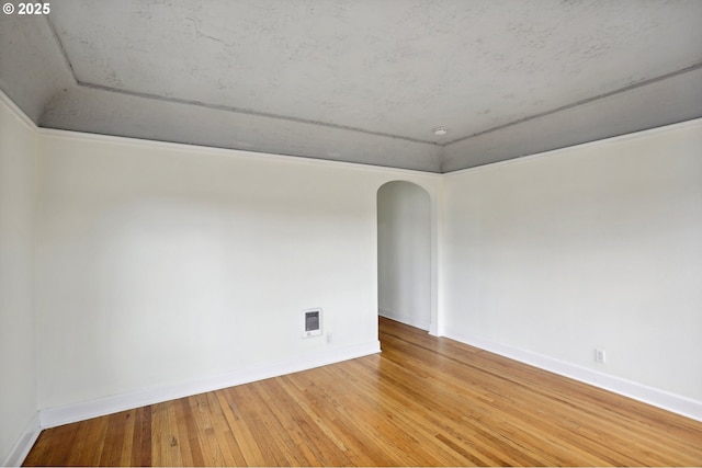 empty room featuring hardwood / wood-style floors