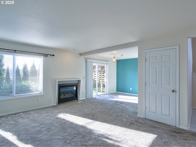 unfurnished living room featuring carpet