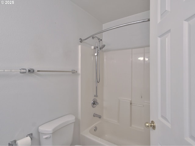 bathroom featuring toilet and bathing tub / shower combination