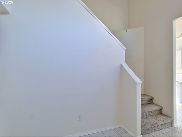 stairs with tile patterned floors